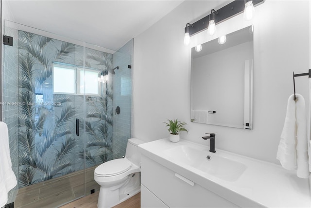 3291 SW 16th Ln, Miami, FL 33145 - bathroom with vanity, toilet, a stall shower, and wood finished floors