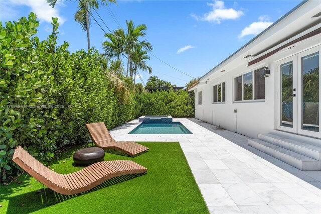 3291 SW 16th Ln, Miami, FL 33145 - rear view of property with a yard, a tiled roof, and stucco siding
