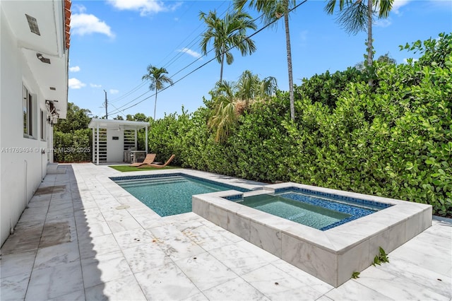 3291 SW 16th Ln, Miami, FL 33145 - view of pool featuring a patio and a pool with connected hot tub