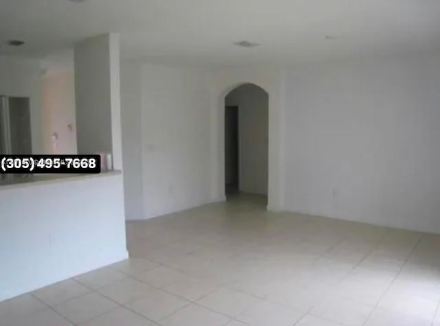 1650 NE 33rd Ave Unit 105-7, Homestead, FL 33033 - unfurnished room with arched walkways