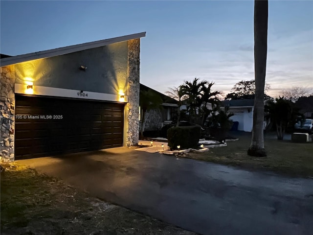 view of front of house featuring an attached garage and driveway