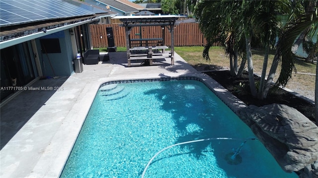 view of pool featuring a patio area, a fenced in pool, and a fenced backyard