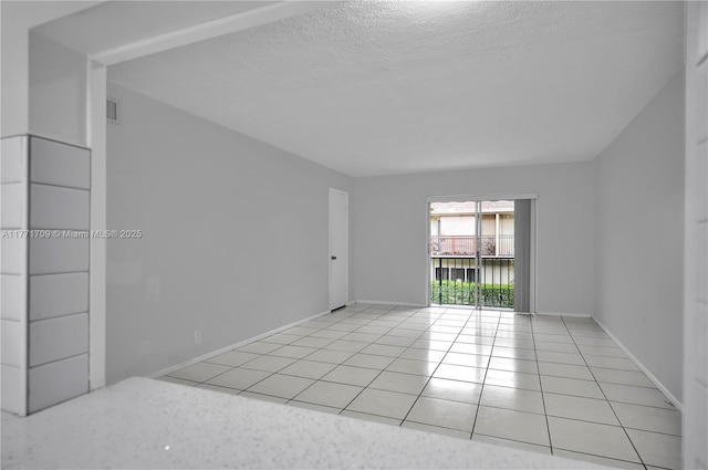 6711 N Kendall Dr Unit 510, Pinecrest, FL 33156 - spare room with light tile patterned floors, a textured ceiling, and baseboards