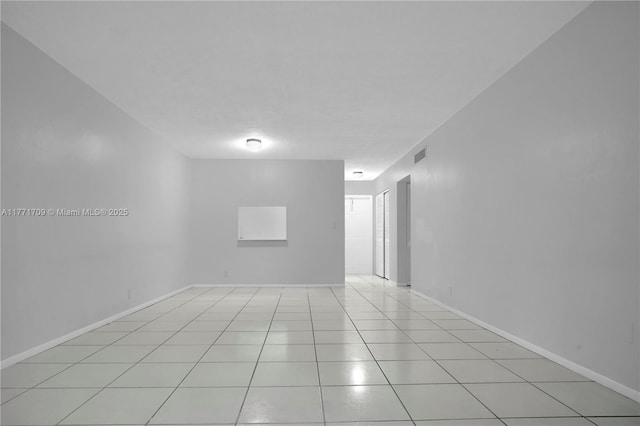 unfurnished room with visible vents and light tile patterned floors