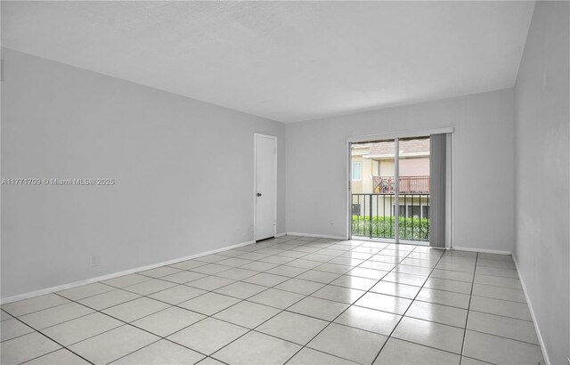 6711 N Kendall Dr Unit 510, Pinecrest, FL 33156 - spare room with light tile patterned floors and baseboards