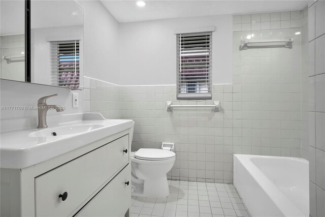 6711 N Kendall Dr Unit 510, Pinecrest, FL 33156 - full bath with tile walls, vanity, toilet, tile patterned floors, and a wainscoted wall
