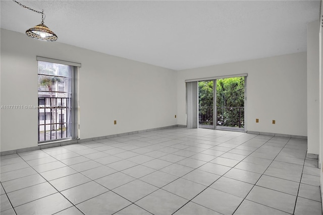 6886 N Kendall Dr Unit D208, Pinecrest, FL 33156 - spare room with light tile patterned floors and baseboards