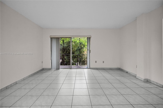 6886 N Kendall Dr Unit D208, Pinecrest, FL 33156 - spare room featuring light tile patterned flooring and baseboards