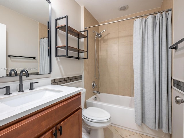 full bathroom featuring tile patterned floors, shower / tub combo with curtain, vanity, and toilet