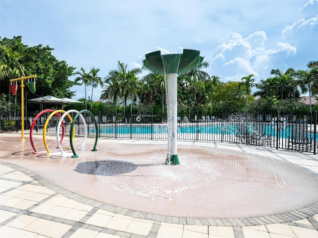 community pool with fence and playground community