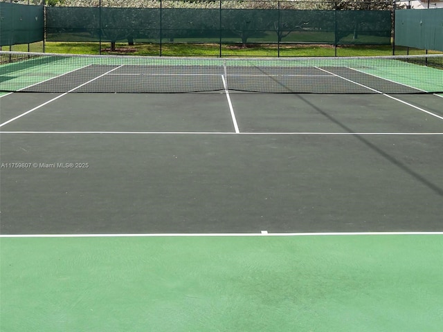 view of sport court with fence