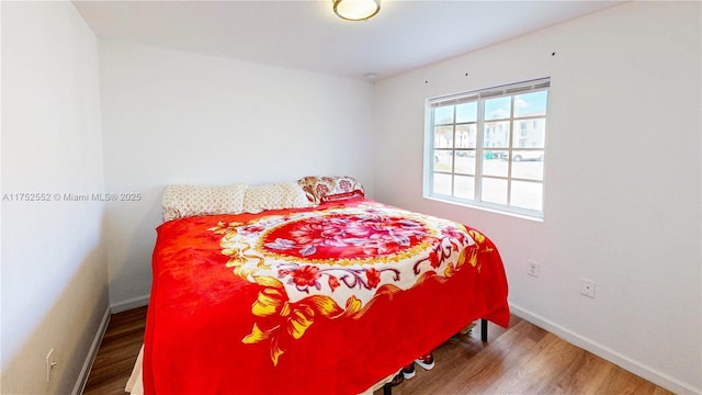 219 SW 6th Ln, Florida City, FL 33034 - bedroom featuring wood finished floors and baseboards