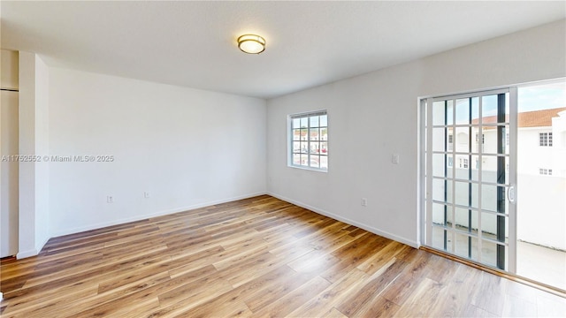 219 SW 6th Ln, Florida City, FL 33034 - unfurnished room featuring baseboards and light wood-type flooring
