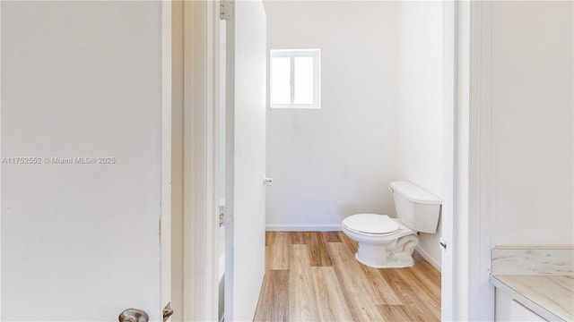 219 SW 6th Ln, Florida City, FL 33034 - bathroom featuring wood finished floors and toilet