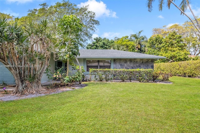 766 NW 24th Ave, Delray Beach, FL 33445 - view of front of house with a front lawn and stucco siding