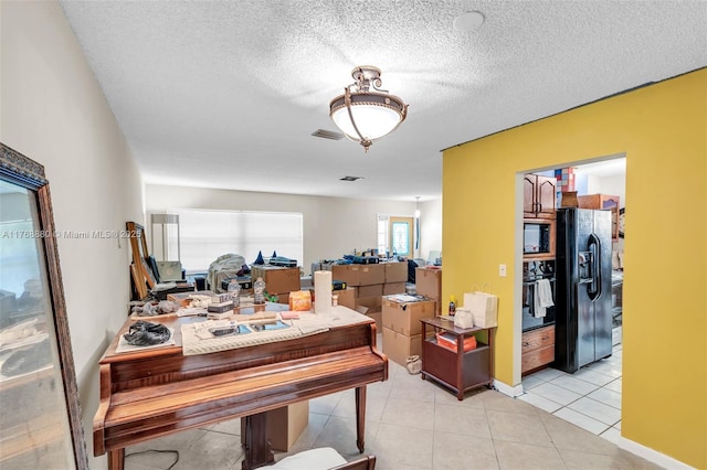 766 NW 24th Ave, Delray Beach, FL 33445 - dining room featuring light tile patterned floors and a textured ceiling