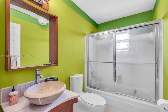 766 NW 24th Ave, Delray Beach, FL 33445 - bathroom featuring bath / shower combo with glass door, vanity, and toilet