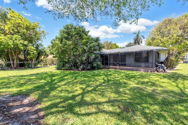 766 NW 24th Ave, Delray Beach, FL 33445 - view of green lawn with a sunroom