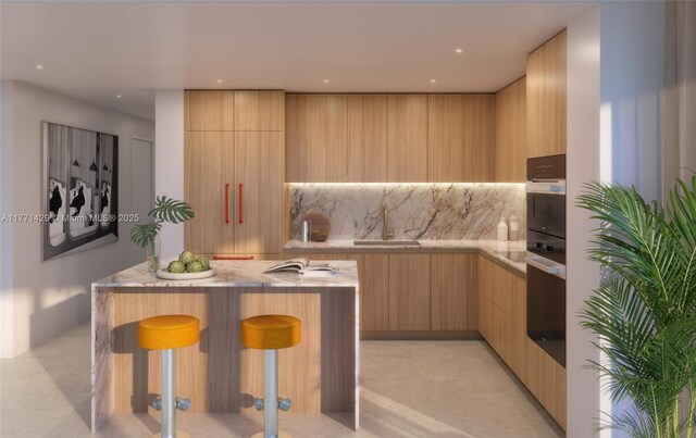 690 SW 1st Ave Unit 2610, Miami, FL 33130 - kitchen featuring modern cabinets, oven, a sink, and light brown cabinets
