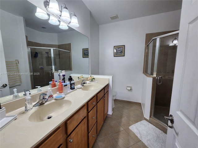 full bath with a shower stall, visible vents, tile patterned flooring, and a sink