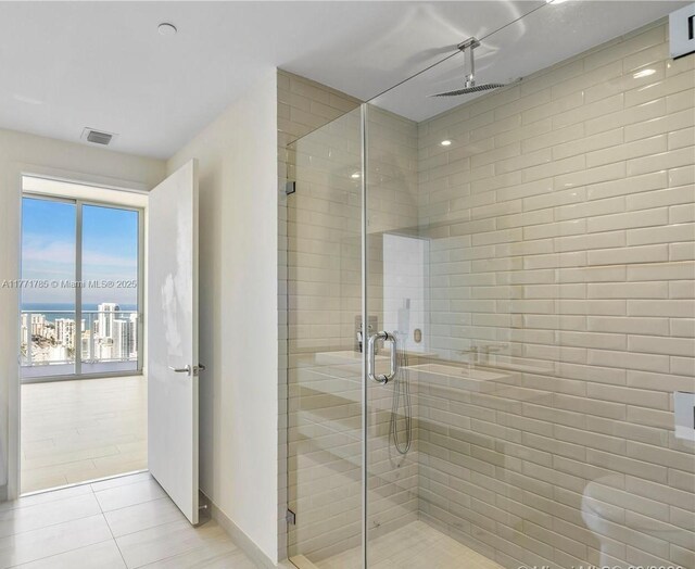 4010 S Ocean Dr Unit T4301, Hollywood, FL 33019 - bathroom featuring tile patterned flooring, a shower stall, baseboards, and visible vents