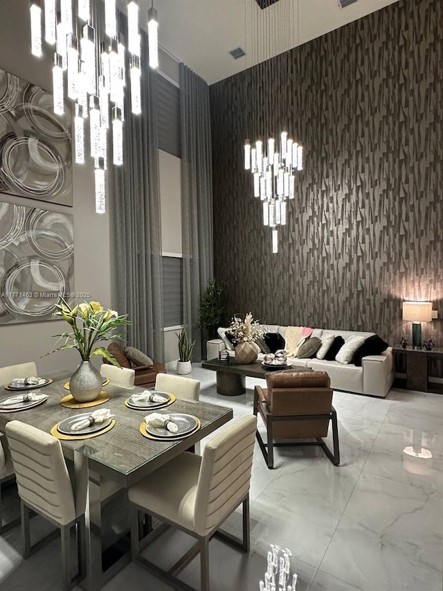 8868 NW 161st Ter, Miami Lakes, FL 33018 - dining space featuring wallpapered walls, a chandelier, and marble finish floors