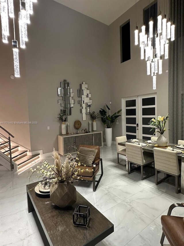 8868 NW 161st Ter, Miami Lakes, FL 33018 - living room featuring marble finish flooring, a towering ceiling, a desk, and stairs