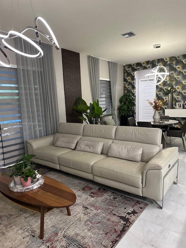 8868 NW 161st Ter, Miami Lakes, FL 33018 - living area with a chandelier, marble finish floors, and wallpapered walls