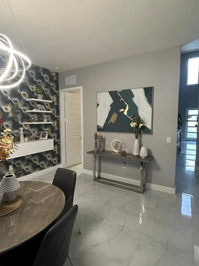 8868 NW 161st Ter, Miami Lakes, FL 33018 - dining room with marble look tile flooring and baseboards