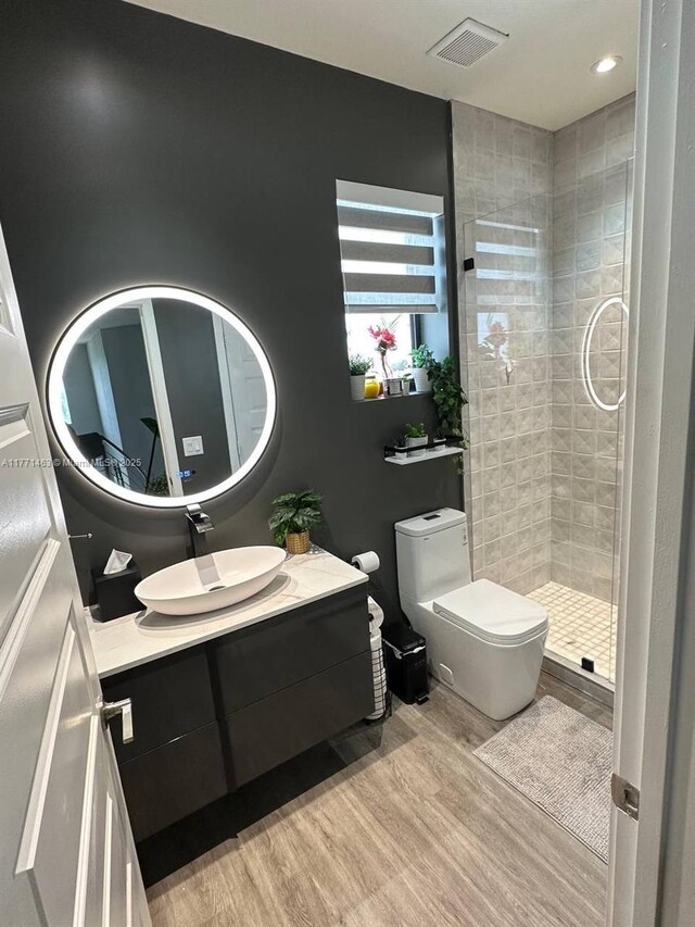 8868 NW 161st Ter, Miami Lakes, FL 33018 - bathroom featuring wood finished floors, vanity, and a shower stall
