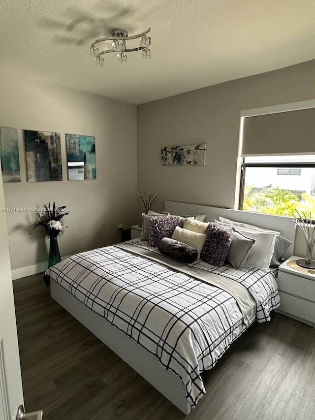 8868 NW 161st Ter, Miami Lakes, FL 33018 - bedroom with wood finished floors and a textured ceiling