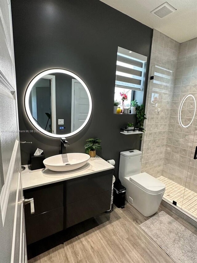 8868 NW 161st Ter, Miami Lakes, FL 33018 - full bath featuring wood finished floors, vanity, and a shower stall