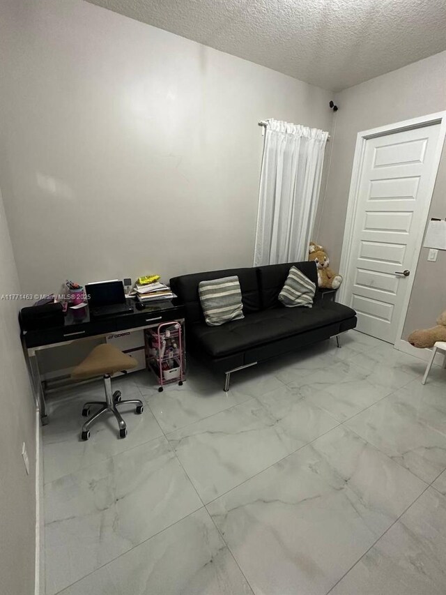 8868 NW 161st Ter, Miami Lakes, FL 33018 - office featuring marble look tile flooring and a textured ceiling