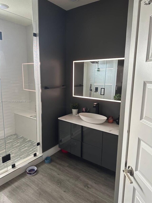 8868 NW 161st Ter, Miami Lakes, FL 33018 - full bathroom with wood finished floors, vanity, and a stall shower