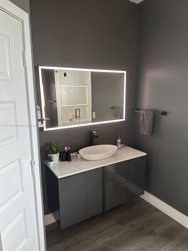 8868 NW 161st Ter, Miami Lakes, FL 33018 - bathroom featuring wood finished floors and vanity