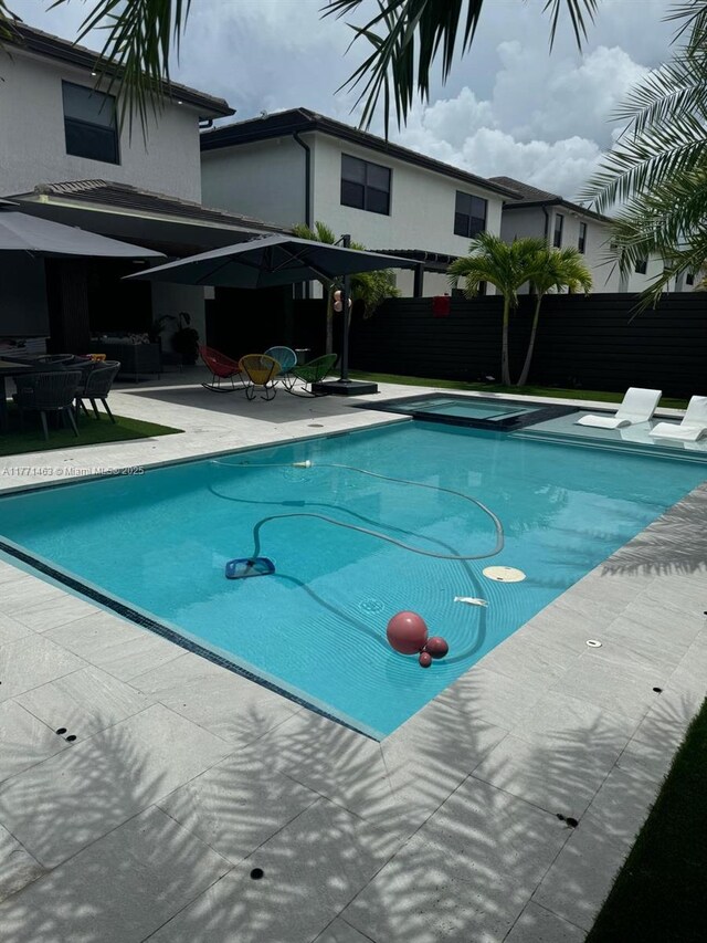 8868 NW 161st Ter, Miami Lakes, FL 33018 - view of pool featuring a patio and an in-ground hot tub