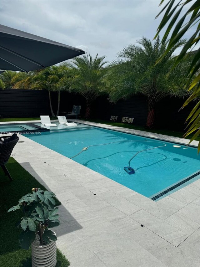 8868 NW 161st Ter, Miami Lakes, FL 33018 - outdoor pool with a patio