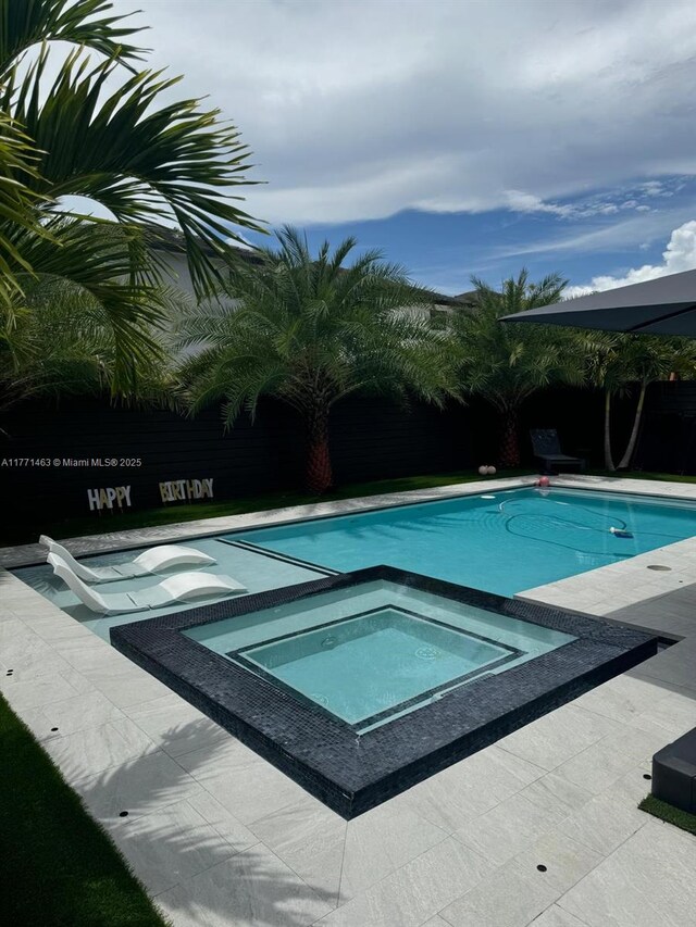 8868 NW 161st Ter, Miami Lakes, FL 33018 - view of swimming pool with a pool with connected hot tub