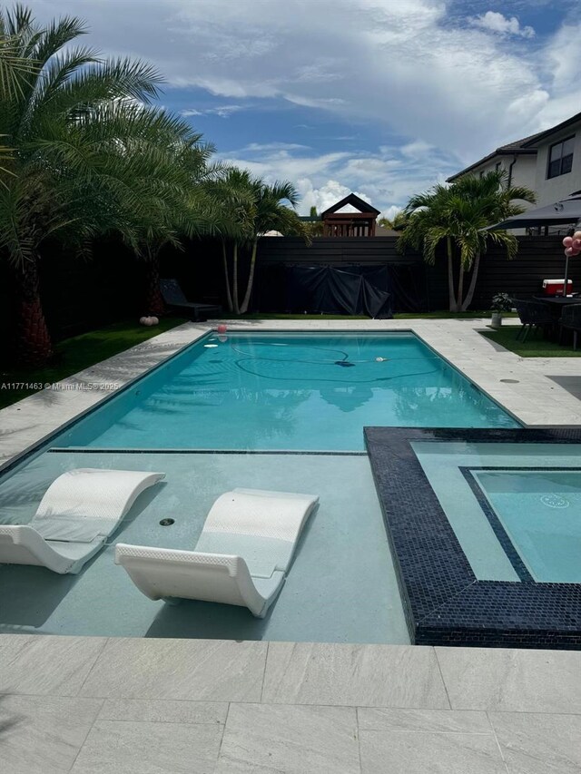 8868 NW 161st Ter, Miami Lakes, FL 33018 - view of swimming pool featuring a fenced backyard