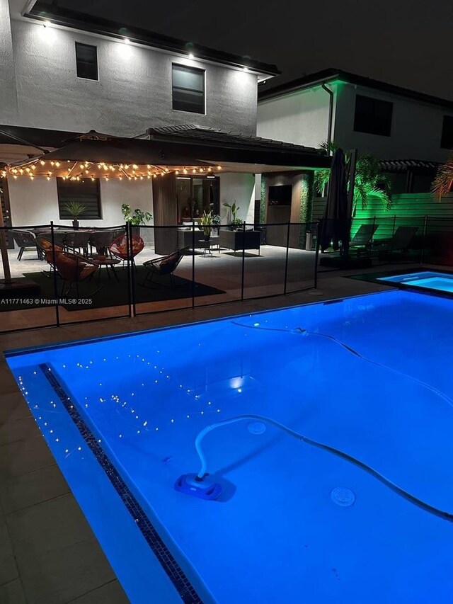 8868 NW 161st Ter, Miami Lakes, FL 33018 - pool at twilight with a patio area