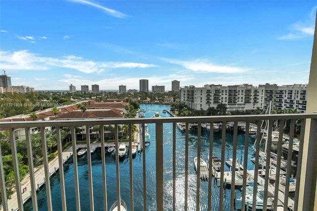 balcony featuring a water view and a view of city