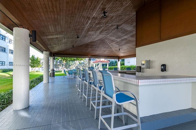 view of community featuring exterior kitchen and a patio area