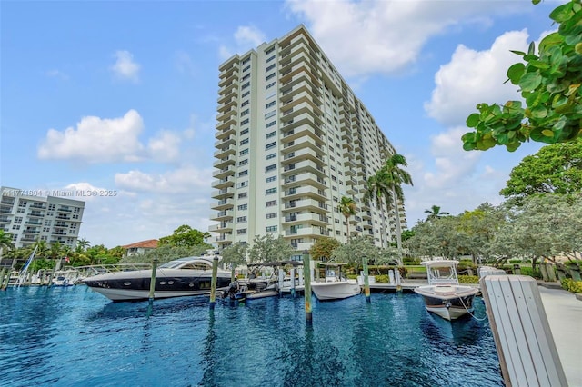 view of pool featuring a water view and a dock