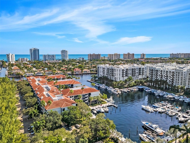 dock area featuring a water view and a view of city