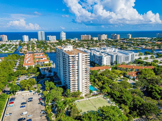birds eye view of property featuring a water view and a view of city