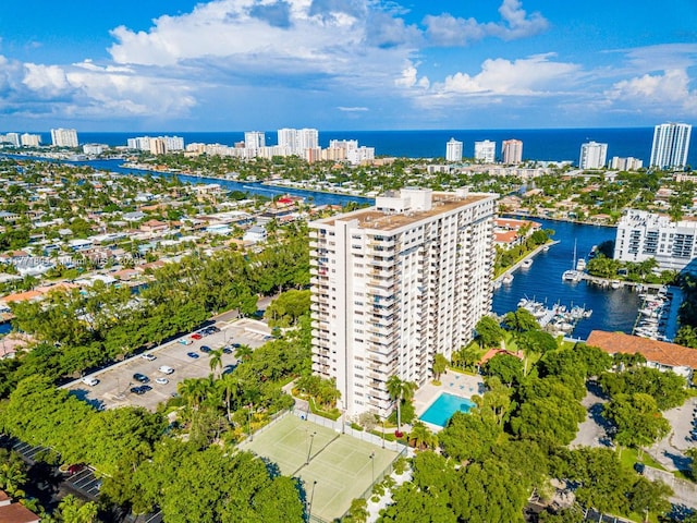 birds eye view of property featuring a water view and a view of city