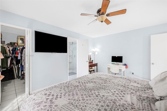 15317 SW 179th Ter, Miami, FL 33187 - tiled bedroom featuring a spacious closet, baseboards, connected bathroom, ceiling fan, and a closet