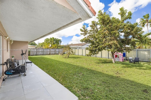 15317 SW 179th Ter, Miami, FL 33187 - view of yard with a fenced backyard and a patio area