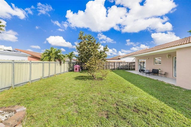 15317 SW 179th Ter, Miami, FL 33187 - view of yard featuring a fenced backyard and a patio