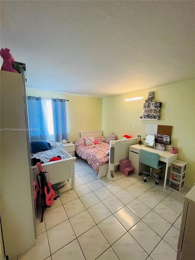 bedroom with light tile patterned floors